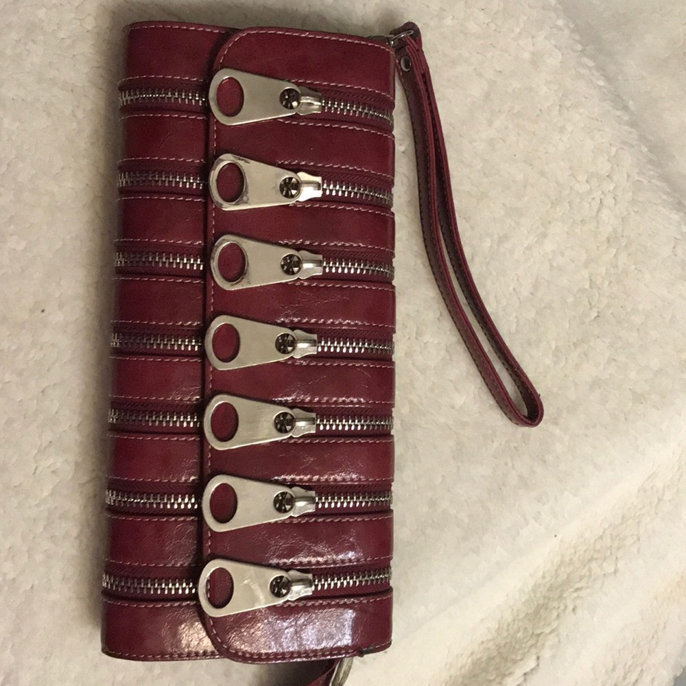 Rare multi zippered clutch By Nicole Lee
